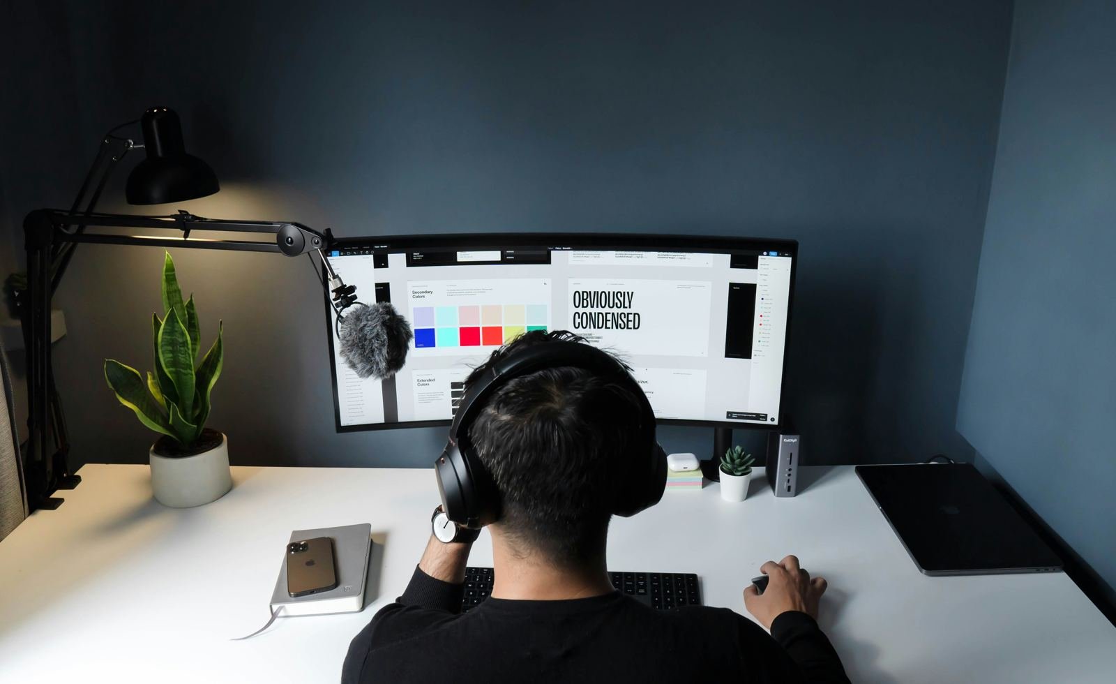 Designer working on brand and layout at a desk