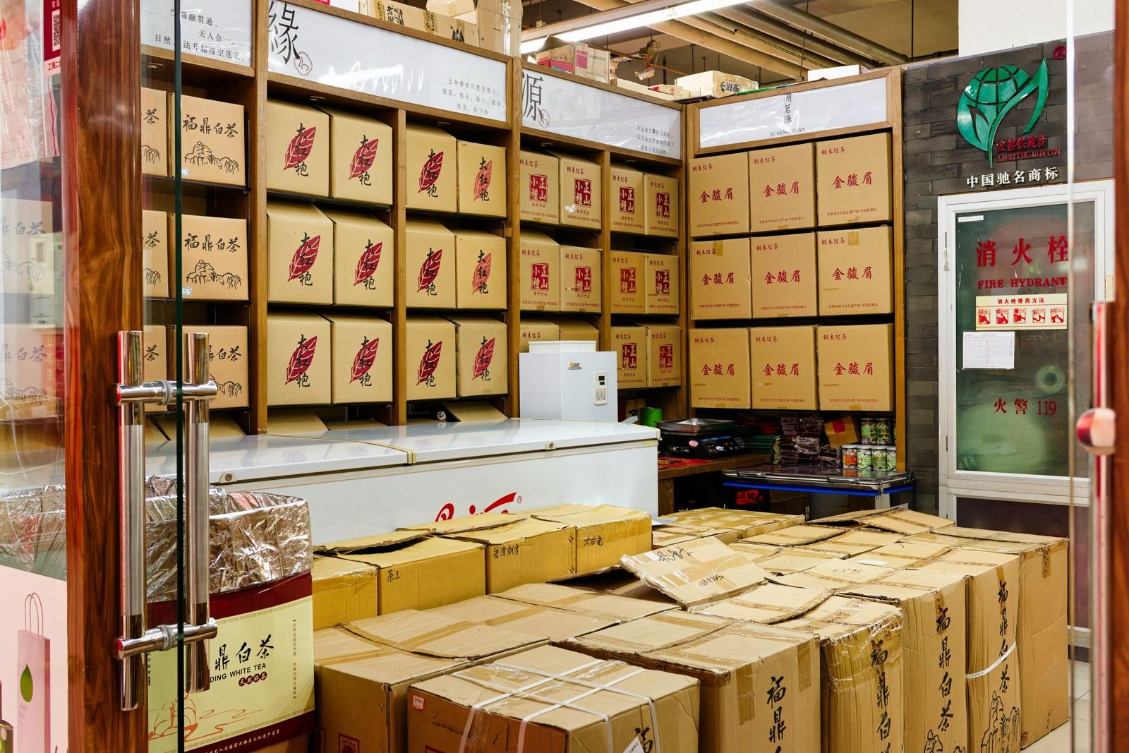 Wholesale stockroom shelves and cartons stacked ready for dispatch